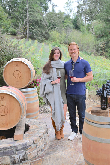 Vineyard winery guests enjoying out Estate Grown Sonoma Coast Pinot Noir.