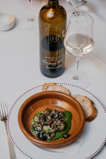 Food / wine pairing of Halleck Vineyard’s Little Sister Sauvignon Blanc from the Russian River Valley with Chef Daniel Boulud’s Escargot Persillade.