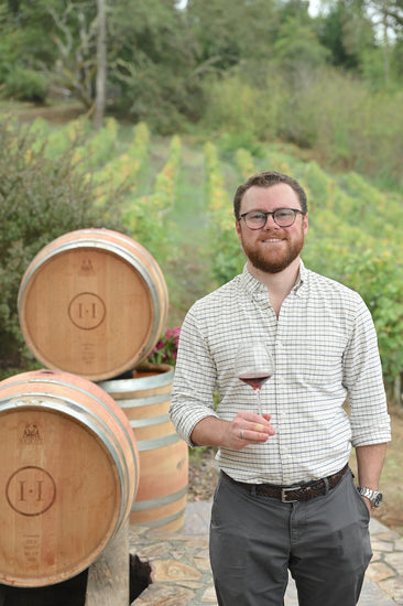 Halleck Vineyard director of wine education Harris Miner sampling our Double-Gold Sonoma Coast Clone 828 Pinot Noir.